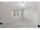 Bright bedroom featuring neutral walls, plush carpet, and window at 5238 Manorwood Dr # 3C, Sarasota, FL 34235