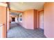 Exterior hallway with muted neutral walls, with natural light, leading to a unit's front door at 5238 Manorwood Dr # 3C, Sarasota, FL 34235
