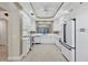 Fully equipped kitchen with white cabinetry, stainless steel appliances, and plenty of counter space at 5238 Manorwood Dr # 3C, Sarasota, FL 34235