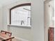 View into kitchen featuring white cabinets, modern fixtures, and an open design at 5238 Manorwood Dr # 3C, Sarasota, FL 34235