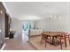 Open floor plan with dining and living room, neutral paint, and balcony access at 5238 Manorwood Dr # 3C, Sarasota, FL 34235