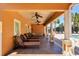 Covered patio with several lounge chairs and ceiling fans at 5238 Manorwood Dr # 3C, Sarasota, FL 34235