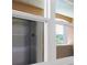 Close up of a window with white frame overlooking an apartment with tan trim at 5238 Manorwood Dr # 3C, Sarasota, FL 34235