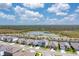 Aerial view of a home with a lake view, backing up to natural Florida preserve at 5715 Woodland Sage Dr, Sarasota, FL 34238
