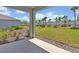 Beautiful backyard with a covered patio and lush green lawn at 5715 Woodland Sage Dr, Sarasota, FL 34238