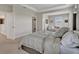 Neutral bedroom featuring tray ceilings, a large walk-in closet, and attached seating area at 5715 Woodland Sage Dr, Sarasota, FL 34238
