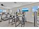 Well-equipped gym area with treadmills, ellipticals, and picturesque windows for a motivating workout at 5715 Woodland Sage Dr, Sarasota, FL 34238