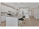 Kitchen island features marble counters, breakfast bar, and stainless steel appliances at 5715 Woodland Sage Dr, Sarasota, FL 34238