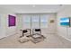 Well-lit loft area with seating and a modern TV, ideal for relaxation or entertainment at 5715 Woodland Sage Dr, Sarasota, FL 34238