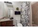 Well-lit bathroom with a vanity, granite countertops, and decorative wall art at 5720 Palmer Cir # 103, Bradenton, FL 34211