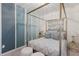 Beautiful bedroom featuring a canopy bed, light blue accents, neutral decor, and soft lighting at 5720 Palmer Cir # 103, Bradenton, FL 34211