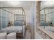 Beautiful bedroom featuring a stylish four poster bed, soft blue accents, and lots of natural light at 5720 Palmer Cir # 103, Bradenton, FL 34211