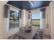 Inviting dining room with modern lighting fixture, neutral decor, and large windows at 5720 Palmer Cir # 103, Bradenton, FL 34211