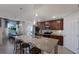Modern kitchen features a large island, stainless steel appliances, and dark wood cabinets with stone countertops at 5720 Palmer Cir # 103, Bradenton, FL 34211