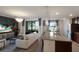 Open-concept living room featuring a kitchen island, comfortable seating, and beautiful views at 5720 Palmer Cir # 103, Bradenton, FL 34211
