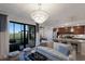 Bright and airy living room offering golf course views, modern furnishings, and an open concept layout at 5720 Palmer Cir # 103, Bradenton, FL 34211
