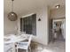 Inviting outdoor patio with a dining table, chairs, and stylish overhead lighting at 5720 Palmer Cir # 103, Bradenton, FL 34211