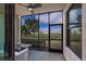 Relaxing screened-in patio with a beautiful view of the green lawn and landscaping at 5720 Palmer Cir # 103, Bradenton, FL 34211