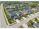 Aerial view of the neighborhood showcasing well-maintained homes, lush landscaping, and a peaceful pond at 5749 Sunflower Cir, Sarasota, FL 34238