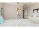 Bedroom featuring a bed, dresser, and an open bathroom at 5749 Sunflower Cir, Sarasota, FL 34238