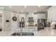 Kitchen featuring stainless appliances, white cabinets and granite countertops at 5749 Sunflower Cir, Sarasota, FL 34238