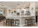 Modern kitchen with a large island, stainless steel appliances, and a convenient breakfast bar at 5749 Sunflower Cir, Sarasota, FL 34238