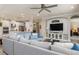 Spacious living room open to a modern kitchen with sleek countertops and stainless steel appliances at 5749 Sunflower Cir, Sarasota, FL 34238