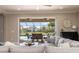 Cozy living room with view of screened-in patio and pool area, perfect for indoor-outdoor living at 5749 Sunflower Cir, Sarasota, FL 34238