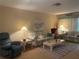 Cozy living room with comfortable furnishings and warm lighting at 6072 Arlene Way # 6072, Bradenton, FL 34207