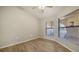 Bright bedroom with wood-look floors, neutral walls and large windows for natural light at 6128 Nicole Dr, Sarasota, FL 34243