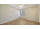 Bedroom features wood-look floors, ceiling fan, and window at 6128 Nicole Dr, Sarasota, FL 34243