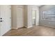 Bedroom boasts wood-look floors, double closet and views to the laundry and neighborhood at 6128 Nicole Dr, Sarasota, FL 34243
