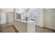 Stylish kitchen with white cabinets, stainless steel appliances, and an open layout for easy entertaining at 6128 Nicole Dr, Sarasota, FL 34243