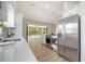 Well-equipped kitchen with stainless steel appliances, white cabinets, and ample counter space for meal preparation at 6128 Nicole Dr, Sarasota, FL 34243