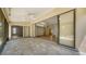 Covered lanai with tile floors overlooking the home's interior at 6128 Nicole Dr, Sarasota, FL 34243