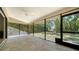 Large screened lanai with neutral tile flooring offers great views to the backyard at 6128 Nicole Dr, Sarasota, FL 34243
