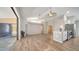 Open concept living room seamlessly connected to the kitchen, offering a modern and spacious living area at 6128 Nicole Dr, Sarasota, FL 34243