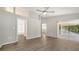 Large main bedroom with ensuite bathroom, walk-in closet, and access to a private screened porch at 6128 Nicole Dr, Sarasota, FL 34243