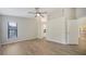Spacious main bedroom featuring wood-look floors, neutral colors, and ensuite bathroom at 6128 Nicole Dr, Sarasota, FL 34243