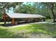 Community pavilion with picnic tables, a covered roof, and space for outdoor gatherings at 6128 Nicole Dr, Sarasota, FL 34243