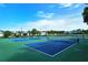 Multiple community pickleball courts with green and blue surfaces, under sunny skies at 6128 Nicole Dr, Sarasota, FL 34243
