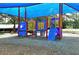 Community playground featuring play structure with climbing wall and tic-tac-toe game at 6128 Nicole Dr, Sarasota, FL 34243