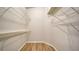 Walk-in closet with wire shelving and wood-look floors at 6128 Nicole Dr, Sarasota, FL 34243