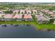 Lakeside homes boast screened in pools, lush tropical landscaping, and scenic views from above at 6209 Erice St, Venice, FL 34293