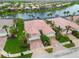 Birds eye view of home featuring brick driveways, two-car garages, and verdant landscaping at 6209 Erice St, Venice, FL 34293