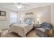 Cozy bedroom featuring light walls, and a ceiling fan, with a turtle themed bed at 6209 Erice St, Venice, FL 34293