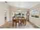 Open concept dining area offering access to the backyard patio and is filled with natural light from the sliding doors at 6209 Erice St, Venice, FL 34293
