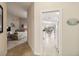 Hallway offers a view from the living area through to the dining and kitchen at 6209 Erice St, Venice, FL 34293