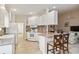 Bright kitchen provides a full range of appliances and access to an open floor plan featuring counter seating at 6209 Erice St, Venice, FL 34293