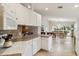 Open kitchen showcases counter space, modern appliances, and seamless flow to the dining area, great for entertaining at 6209 Erice St, Venice, FL 34293
